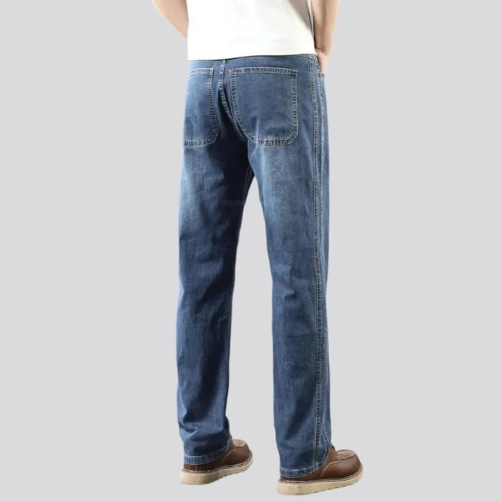 Thin men's whiskered jeans